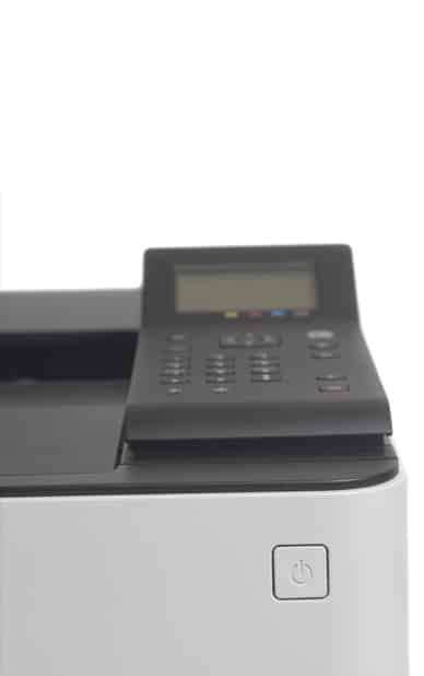 This image shows a multifunction printer or fax machine, equipped with a control panel featuring a small screen, buttons, and color indicators. The device is likely used as part of the coworking email-to-fax service at RingSpaces of Fredericksburg. A power button is visible on the lower corner of the device.